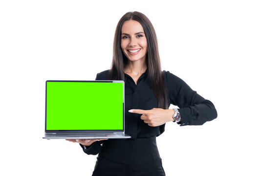 Happy businesswoman pointing at open laptop computer with green screen chroma key effect mockup