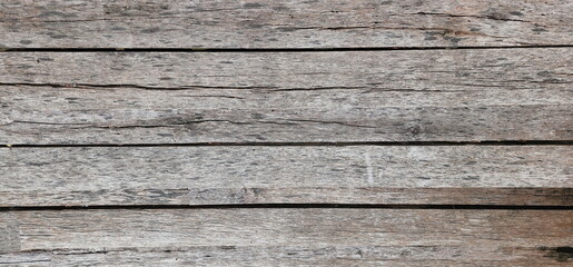 Pattern of old wooden floor Horizontal image of small wooden planks with different patterns stacked together to form a fence, bridge. or furniture
