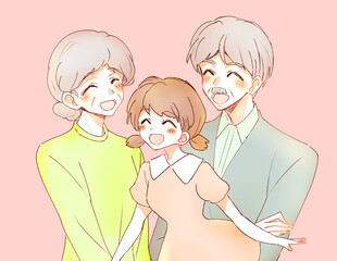 笑顔のおじいさんとおばあさんと孫