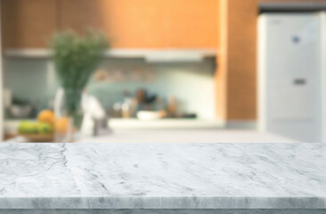 Selective focus,Marble table top on blur white kitchen room background.