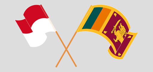 Crossed and waving flags of Monaco and Sri Lanka