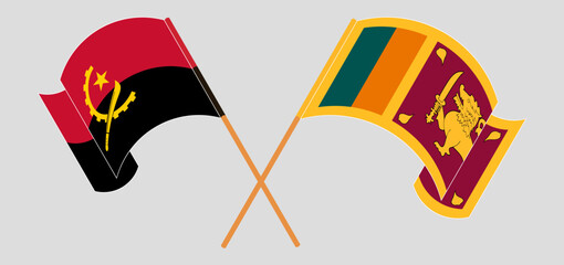 Crossed and waving flags of Angola and Sri Lanka