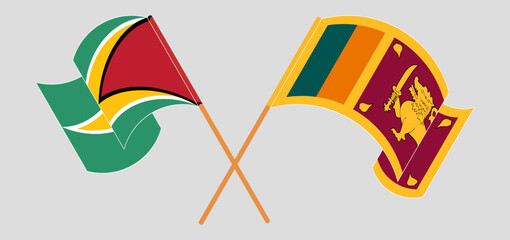 Crossed and waving flags of Guyana and Sri Lanka