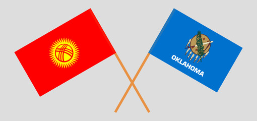 Crossed flags of Kyrgyzstan and The State of Oklahoma. Official colors. Correct proportion
