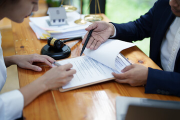 Law and legitimacy, portrait of lawyer and client signing important contract documents