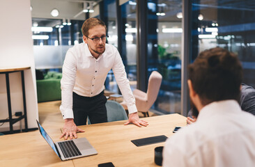 Male colleagues working on project in office