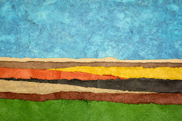 abstract landscape created with sheets of textured colorful handmade paper