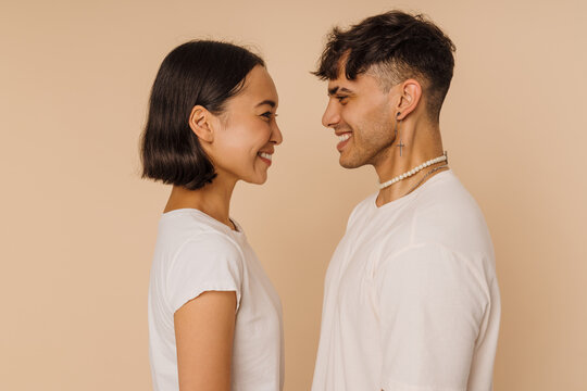 Young beautiful asian smiling woman and stylish smiling man
