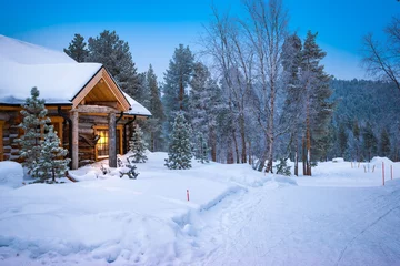 Gordijnen Wooden cabin in the snow. Lapland, Finland, Scandinavia. © Nancy Pauwels