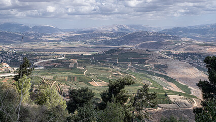 Obraz premium View of Southern Labanon villages Marjayoun, Al Qulayah, Al Khiyam, Kafr Kla, Kafr Shuba, Al Ghajr with Metula as seen from Mitzpe Benya lookout, located at the foot of Misgav Am, Upper Galilee,Israel
