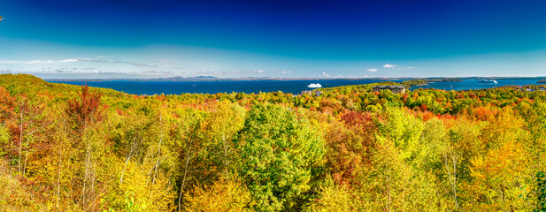 Acadia National Park panoramic view during foliage season, Maine, New England - USA. Trees and ocean