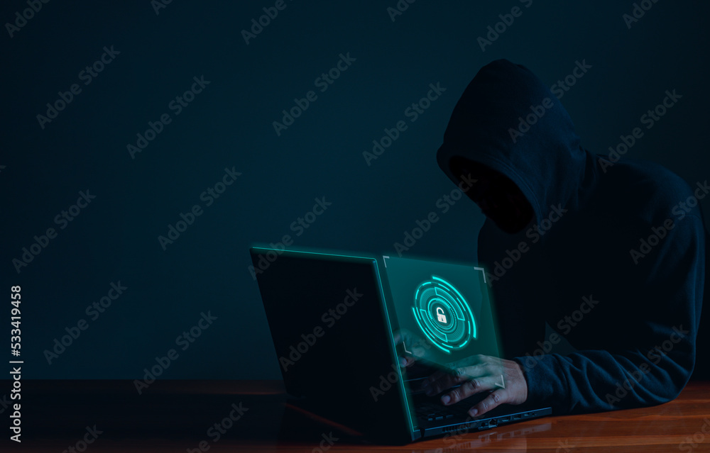 Aufkleber hackers work on laptops in the dark. the concept of information security in the internet network and