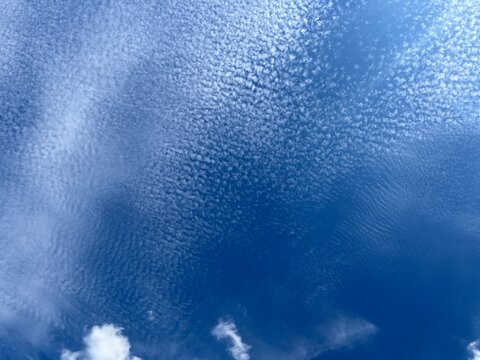 fantastic blue sky with some white fluffy clouds, natural colors