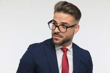 portrait of sexy businessman with glasses looking away