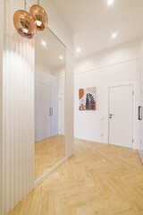 Interior design of the apartment. Wood flooring and light walls