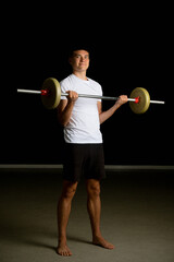 Obraz premium Nineteen year old teen boy exercising