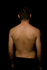 Fototapeta premium Nineteen year old teen boy shirtless back