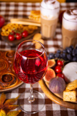 Autumn outdoor picnic set or dinner for celebration Thanksgiving Day. Holiday party. Festive table. Snacks, friuts,pie, vegetables, wine glasses.