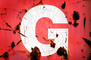 Metal Letter G with Rust and Peeling Red Paint