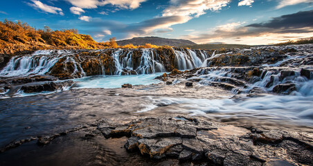 Scenic image of Iceland. Incredible nature landscape. Stunning view of Bruarfoss Waterfall. Azure...