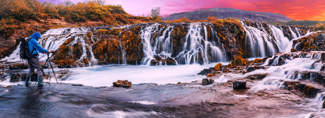 A beautiful river morning with waterfall and sun light. Scenic panorama  image of Iceland. Colorful sunset over the Bruarfoss Waterfall with picturesque sky during sunset. Amazing nature of Iceland.