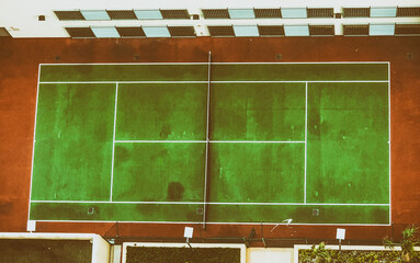 The modern tennis court shot in bird's eye view. Drone viewpoint