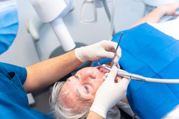 Dental clinic, elderly woman at the dentist with the doctor at the denture checkup