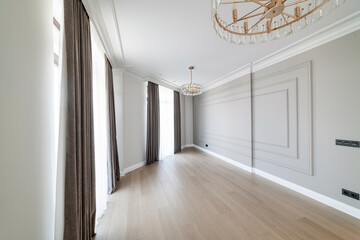 interior of a new room with a dark wall and wooden floor