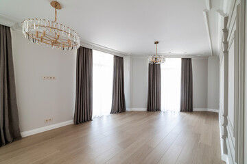 interior of a new room with a dark wall and wooden floor
