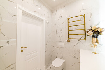 Fototapeta na wymiar bathroom interior design with tiles, mirror and white furniture