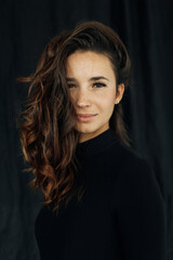 beautiful young caucasian woman portrait on black background