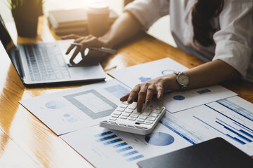 Naklejka premium Female accountants working with laptops and business financial reports. Accounting Analysis and Money Planning