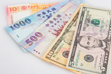 Obraz na płótnie Canvas Close up shot of America, Taiwan and Macau dollar bills