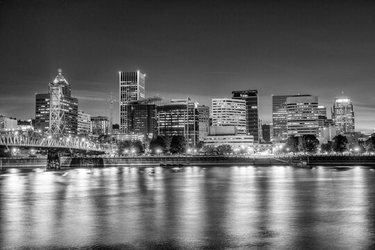 Modern night skyline of Portland with river light reflections © jovannig