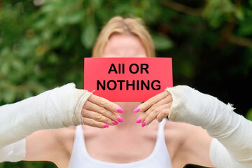 The text written on the ALL OR NOTHING card means that you are doing something either completely or...