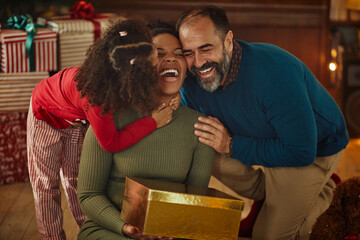 Multiracial family celebrating Christmas at home