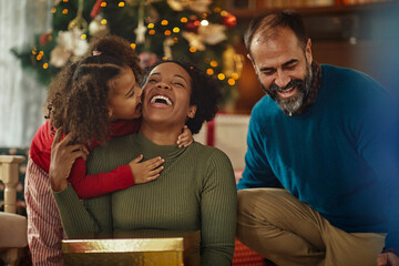 Multiracial family celebrating Christmas at home