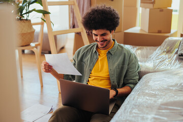 Man reviewing apartment lease documents.