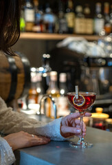 Martinez. The bartender makes fresh marti. Alcoholic martinez cocktail on the bar.