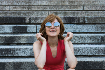 Portrait of a young woman with sunglasses