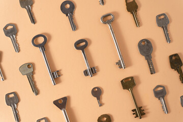 Key pattern. Background from different old keys. view from above. Door key in white and yellow metal.