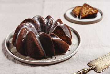 Pumpkin tangerine bundt cake with pumpkin spice and nuts for winter dinner. Selective focus