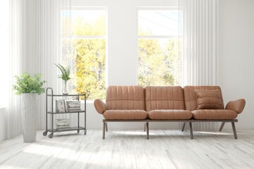 Stylish room in white color with sofa and autumn landscape in window. Scandinavian interior design. 3D illustration