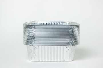 Disposable aluminum tableware isolated on white background. aluminum foil deep bowls