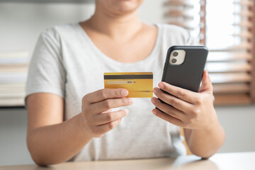 Woman using smart phone pay bill to make online payment or online shopping, cashless payment.