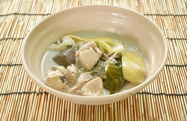 boiled chicken with slice banana blossom and cabbage in coconut milk soup on bowl