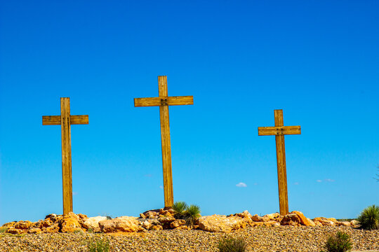 Three Wooden Crosses On Hilltop