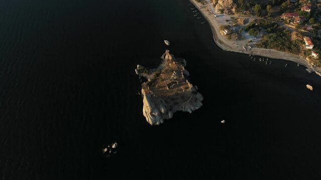 Aerial footage of a lake and islands, top view of bafa lake with sunset light and day time light