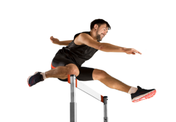 Young male athlete at hurdle race