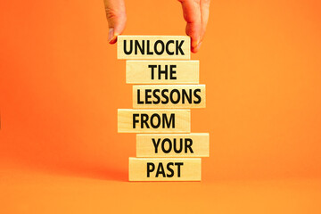 Lessons from your past symbol. Concept words Unlock the lessons from your past on wooden blocks....